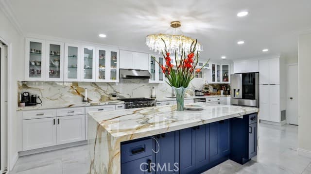 Marble-appointed kitchen with island